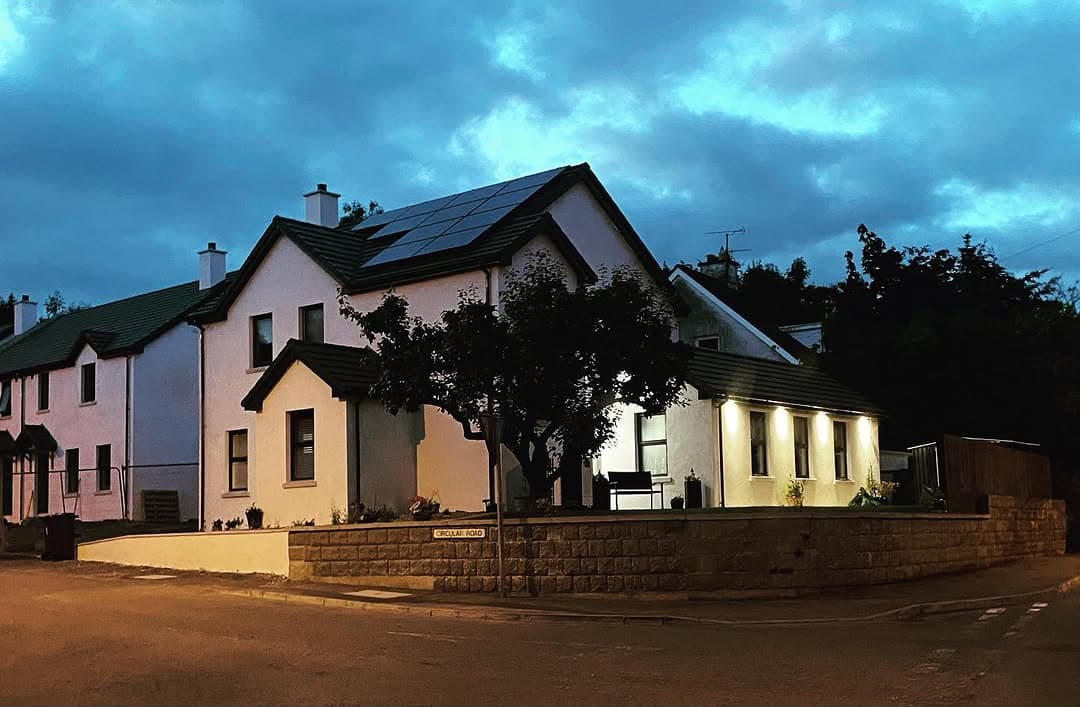 The Forge development home at night with exterior lighting, Lisbellaw